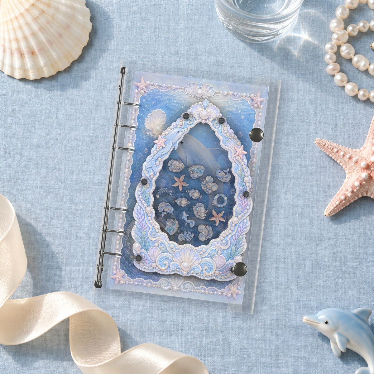 Dolphin Pearl Garden shaker binder on a styled desk