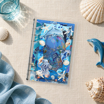 Dolphin Ocean Collage shaker binder on a styled desk