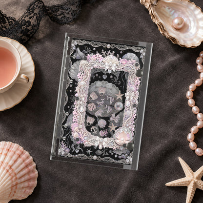 Shell Pearl Pendant shaker binder on a styled desk