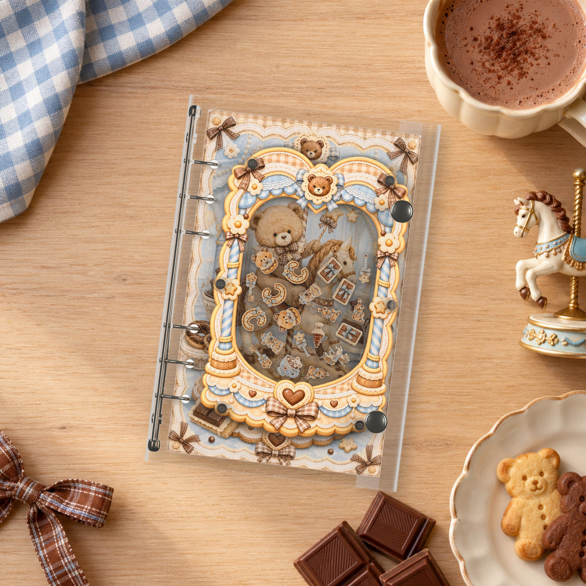Chocolate Carousel Bear shaker binder on a styled desk
