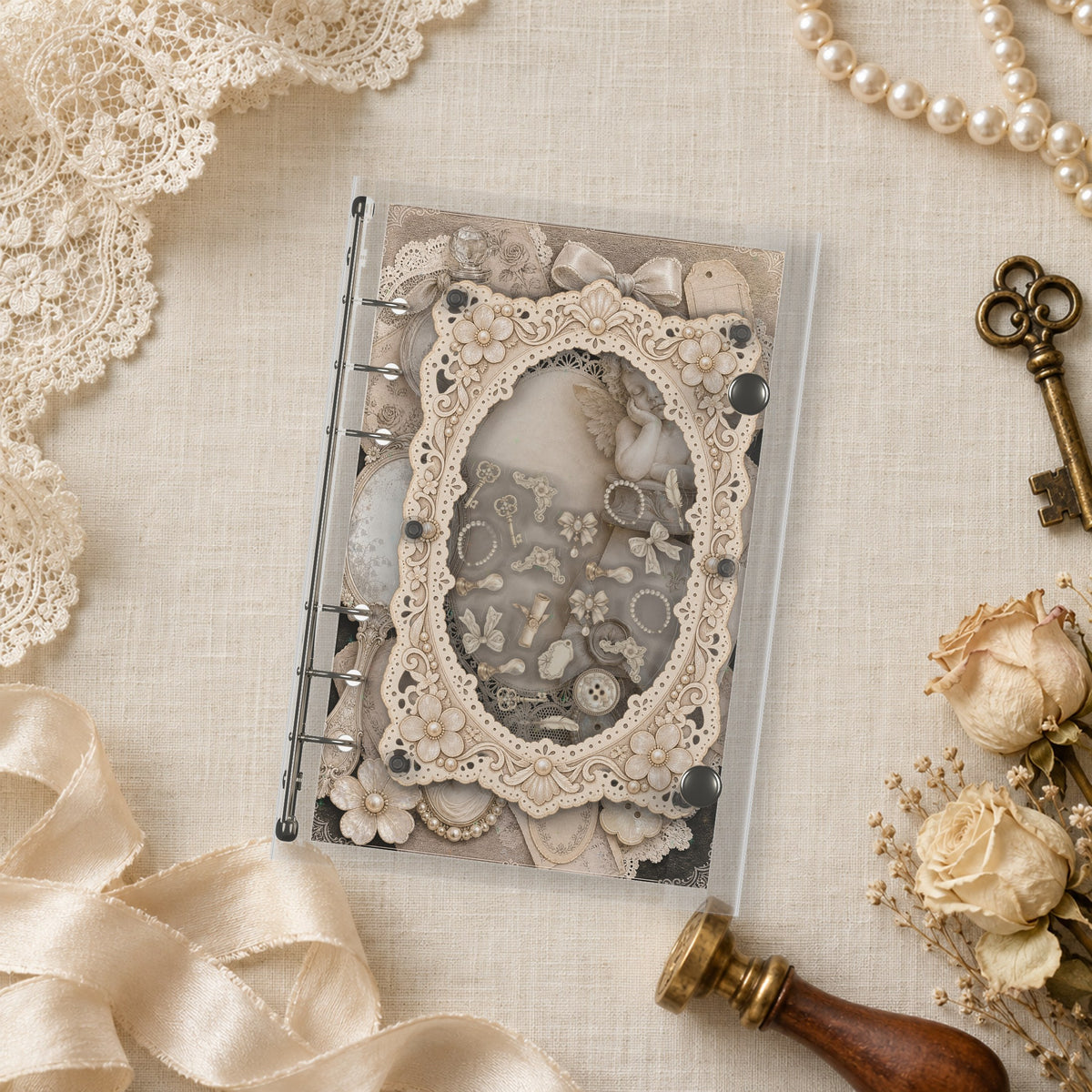 Vintage Lace Ephemera shaker binder on a styled desk