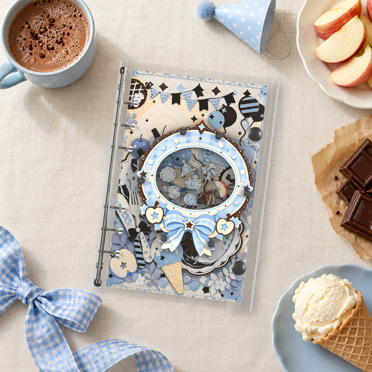 Blue Apple Party shaker binder on a styled desk