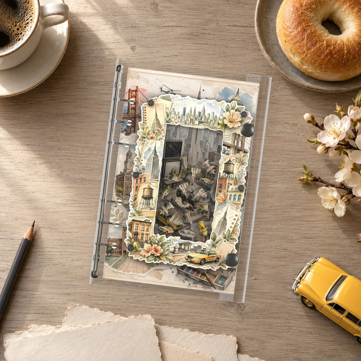 New York Collage shaker binder on a styled desk