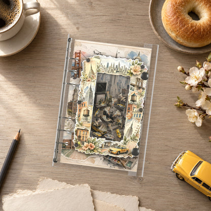 New York Collage shaker binder on a styled desk