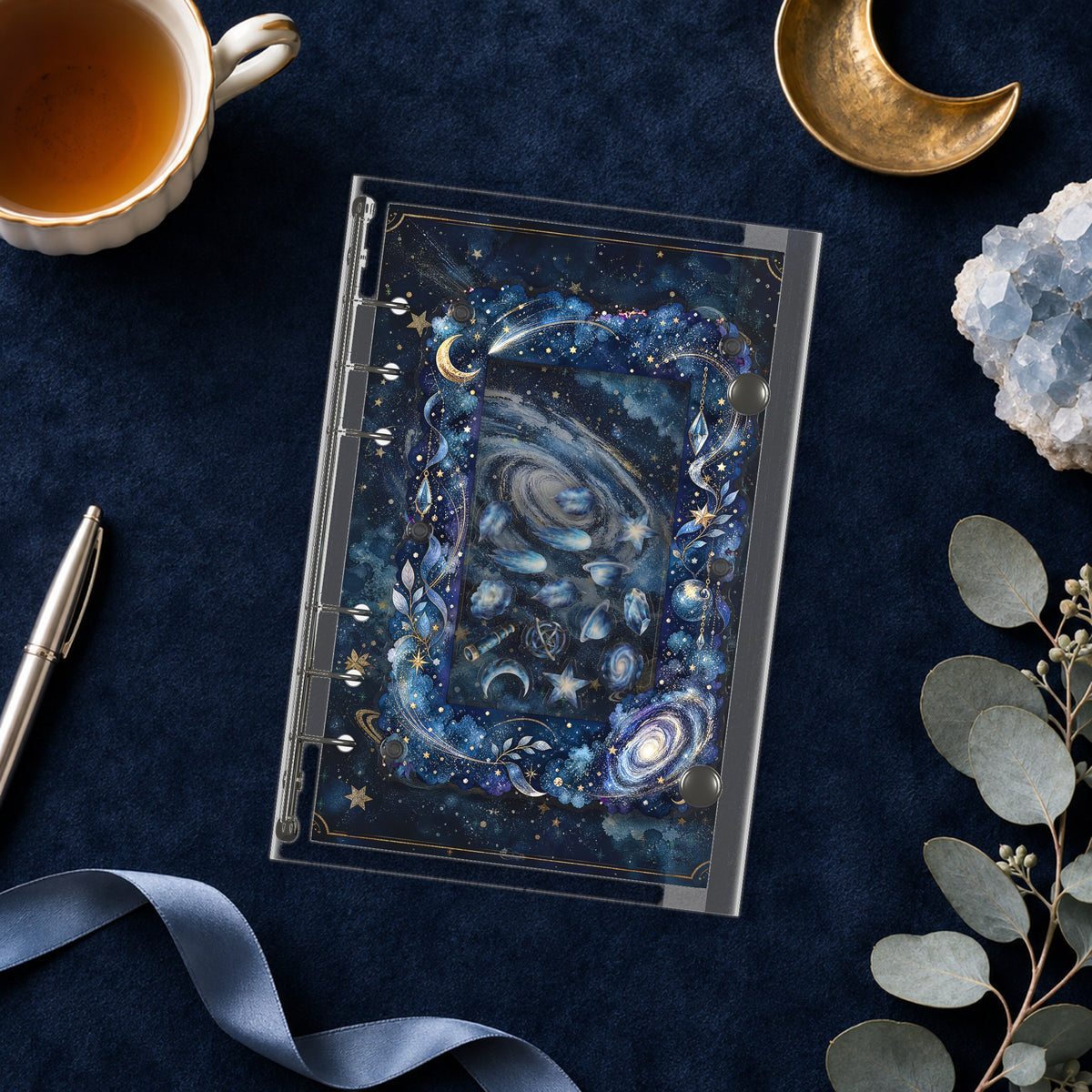 Galaxy Moon shaker binder on a styled desk