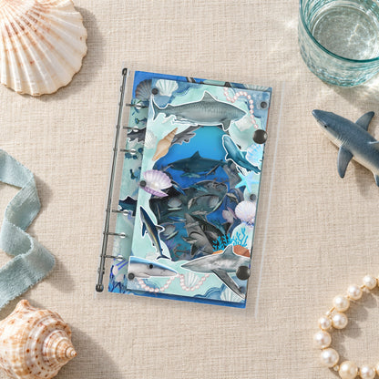 Shark Reef shaker binder on a styled desk
