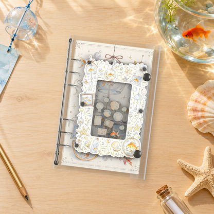 Goldfish Aquarium shaker binder on a styled desk