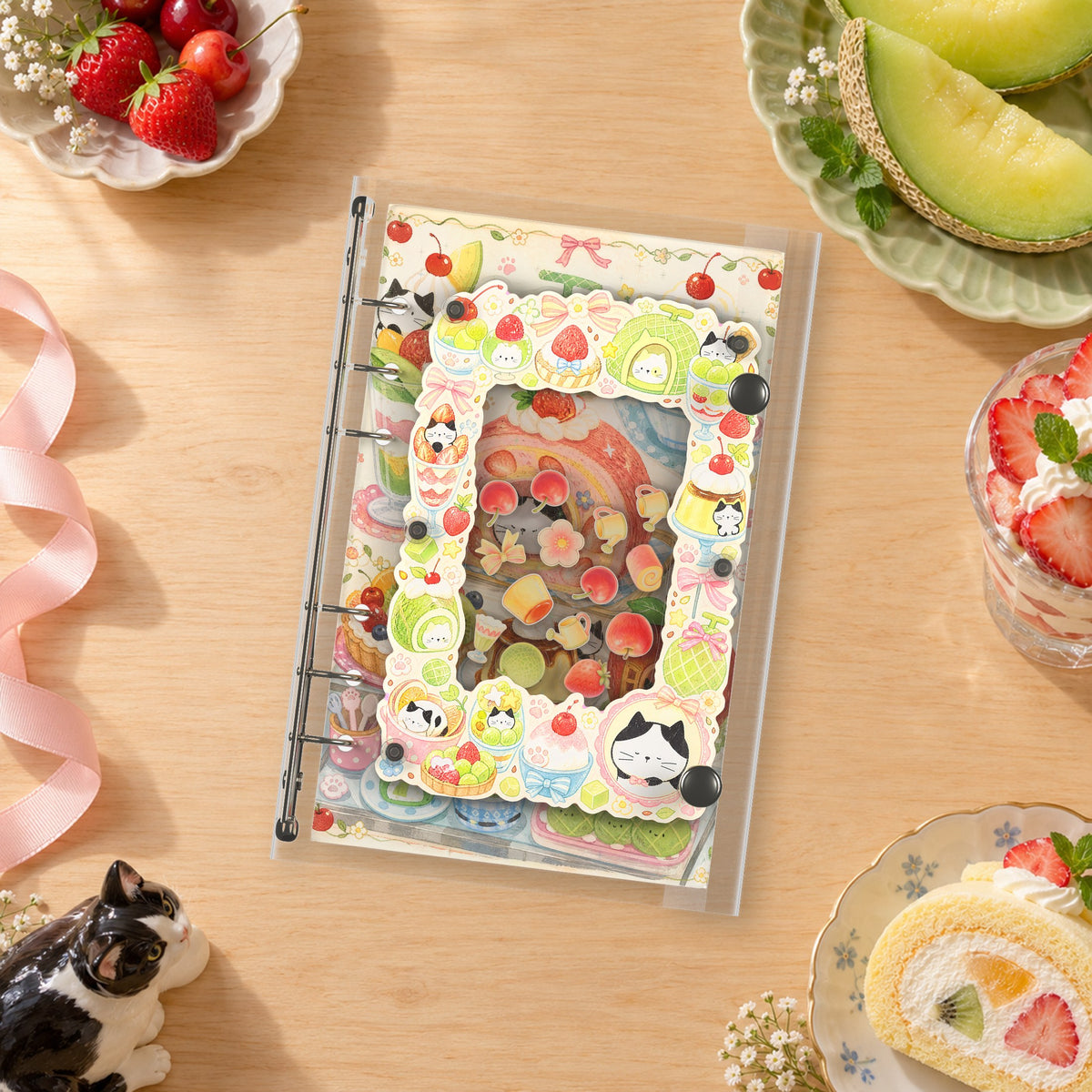 Fruit Cat Party shaker binder on a styled desk