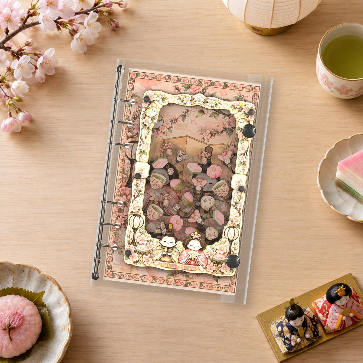Hina Doll Sakura Tea shaker binder on a styled desk