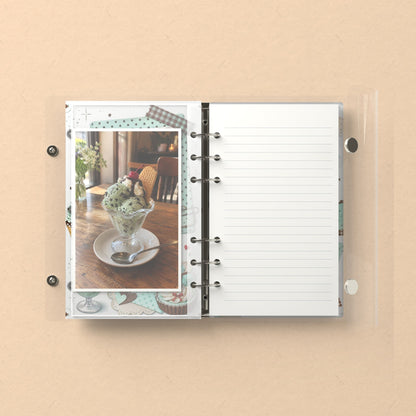 Inside: a photo sleeve and a lined refill page