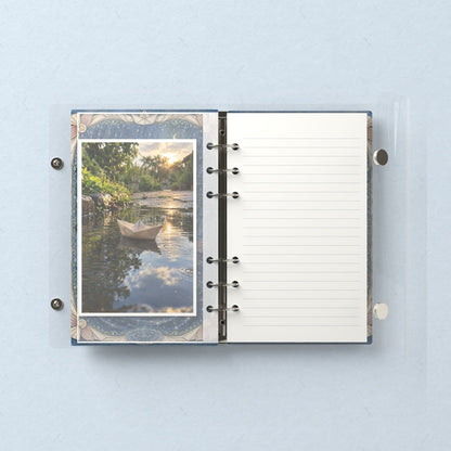 Inside: a photo sleeve and a lined refill page