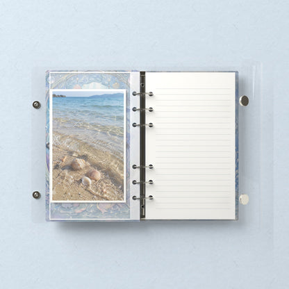 Inside: a photo sleeve and a lined refill page