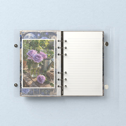 Inside: a photo sleeve and a lined refill page