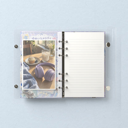 Inside: a photo sleeve and a lined refill page