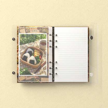 Inside: a photo sleeve and a lined refill page