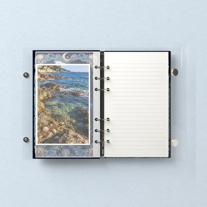 Inside: a photo sleeve and a lined refill page