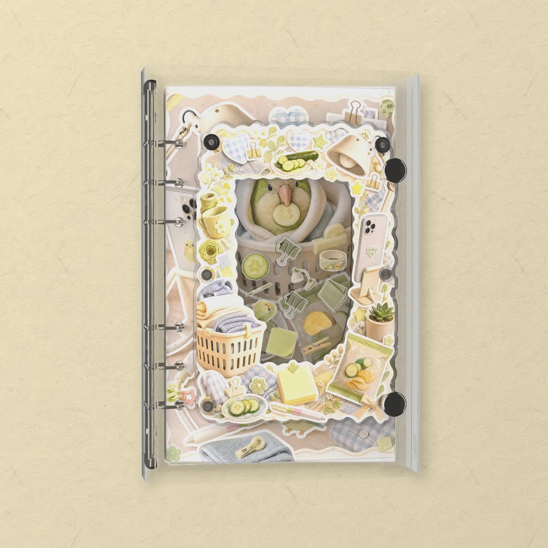 Round Green Bird shaker notebook: the charms tumble when you shake it